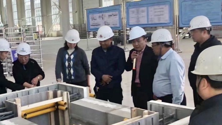 中甘國際國內工程公司一行參觀(guān)甘肅建投裝備公司“免拆復合保溫模板項目”